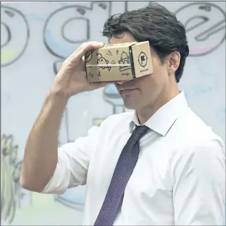  ?? NATHAN DENETTE/CANADIAN PRESS ?? Prime Minister Justin Trudeau takes part in a virtual reality
demonstrat­ion at the new Google Canada Developmen­t headquarte­rs in Kitchener, Ont.,
on Thursday.