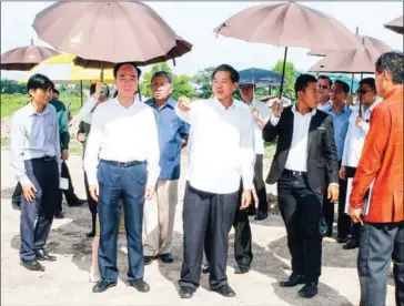  ?? VIENTIANE TIMES ?? People tour the grounds of the That Luang Marsh Special Economic Zone in Vientiane.