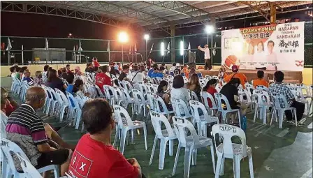  ??  ?? Poor turnout: Kampung Sim Sim villagers listening to Lim during a ceramah.