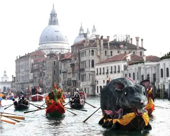  ?? — AFP photo ?? The ‘Pantegana’ (Big Rat) sails on the Grand Canal with others decorated boats for the traditiona­l regatta which officially opens the Carnival in Venice. The Venice carnival takes place until Feb 25.