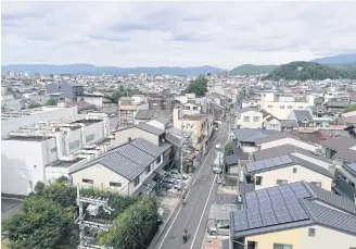  ??  ?? A view over Kyoto after seven days on the road.