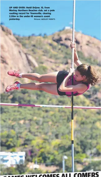  ?? Picture: WESLEY MONTS ?? UP AND OVER: Heidi Drijver, 15, from Mackay Northern Beaches club, set a pole vaulting record for Townsville, clearing 2.20m in the under- 18 women’s event yesterday.