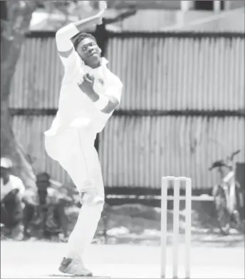  ?? (Royston Alkins photo) ?? The 16-year-old left-arm spinner Ashmead Nedd got good purchase on a wearing pitch during his damaging spell against West Demerara yesterday.