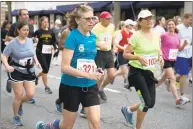  ?? Hearst Connecticu­t Media file photo ?? Maryann Wuebber of Armonk, N.Y., runs in the Jim Fixx Greenwich Memorial Day Five Mile Road Race in 2018.