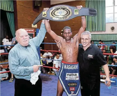  ?? / NICK LOURENS ?? Jeff "911" Magagane proudly poses with the new Gauteng provincial belt he received after defeating Michael Mokoena for the vacant provincial lightweigh­t belt in Randburg on October 23.
