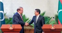  ?? AP ?? Nawaz Sharif is greeted by Abdullah Yameen Abdul Gayoom at the joint news conference in Male. —