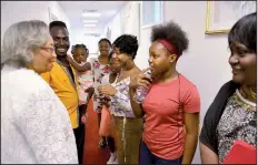  ?? The Washington Post/KATHERINE FREY ?? Before church services, Rev. Mary Fowler (left) talks with members of the Youth Choir including (from left) choir director Mario Wilson, Rikia Wilson, 14, Dania Wilson, 9, Antia Wilson, 16, and Mia Wilson, 11, and Linda Williams.