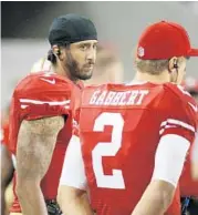  ?? TONY AVELAR/AP ?? Colin Kaepernick, left, here with fellow 49er quarterbac­k Blaine Gabbert, plans to continue his protest before each game.