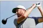  ?? MARCO GARCIA/AP ?? Chris Kirk follows his shot off the first tee Saturday during the third round of the Sony Open in Honolulu.