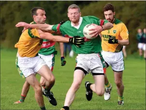  ??  ?? Peter O’Shea, Tousist, in possession and under pressure from Castlegreg­ory’s James Galwey and Gearóid Fitzgerald in the County JFC semi-final. Photo by Michelle Cooper Galvin