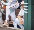  ?? SARA DIGGINS/AMERICAN-STATESMAN ?? Texas baseball coach David Pierce shown in the dugout on Friday. Pierce drew a two-game suspension on Sunday.