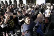  ?? MARCIO JOSE SANCHEZ — THE ASSOCIATED PRESS FILE ?? In this Wednesday file photo “Pokemon Go” players begin a group walk along the Embarcader­o in San Francisco. Die-hard players and one industry observer say the mass hysteria of the augmented reality smartphone game ‘Pokemon Go’ is likely over. It’s a...