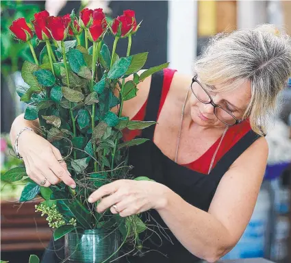  ?? THINK LOCAL: Buyers are being urged to seek out pricier but better quality Australian- grown roses this Valentine’s Day. ??
