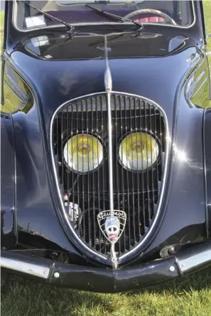  ??  ?? Moving the headlights inside the grille was for aerodynami­c purposes. Below The ohv alloy head engine manages 30 hp from its 1133cc