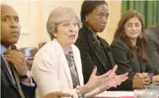  ?? — Reuters ?? Prime Minister Theresa May hosts a discussion around the cabinet table on the findings of the Race Disparity Unit, in 10 Downing Street on Tuesday.