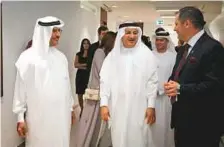  ??  ?? Humaid Al Qutami (centre) with Neil Buckley (right), CEO of King’s College Hospital UAE, and Ahmad Humaid Al Tayer, chairman of KCH UAE and Al Tayer Group, during a tour of the new medical centre in Dubai.