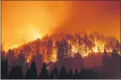  ?? NOAH BERGER — THE ASSOCIATED PRESS FILE ?? On Sept. 27, the Glass Fire burns a hillside above Silverado Trail in St. Helena.