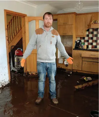  ??  ?? Gerard Gallagher in his flood-damaged home in Burnfoot, Donegal. Photo: Caroline Quinn
