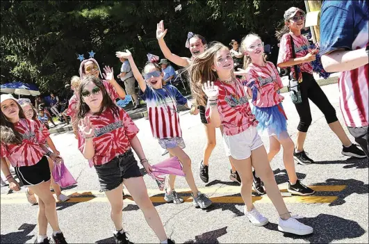  ?? ?? Members of the Green-Roy Academy of Irish Dance march in the annual Arnold Mills 4th of July Parade in Cumberland Monday.