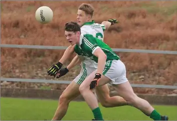  ??  ?? No shortage of determinat­ion from Billy Wickham (Cloughbawn) and direct opponent Ronan Devereux.