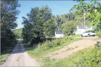  ??  ?? The former railroad corridor at Creignish is shown on the left, with the little general store in the centre of this picture, on the right side.