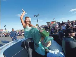  ?? MICHAEL LOCCISANO/GETTY IMAGES ?? Miss Arizona Jennifer Smestad in the 2014 Miss America Competitio­n Parade at Boardwalk Hall Arena on Sept. 14, 2013, in Atlantic City, N.J.