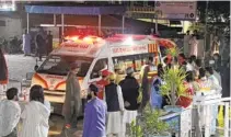  ?? NAVEED ALI AP ?? Rescue worker unloads earthquake victims from an ambulance at a hospital in Saidu Sharif, Pakistan, on Tuesday.