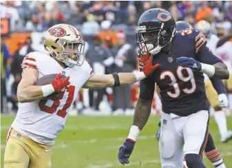  ?? Jonathan Daniel / Getty Images ?? 49ers receiver Trent Taylor tries to hold off the Bears’ Eddie Jackson on a 33-yard reception for a first down that set up the game-winning field goal. The rookie caught six passes for 92 yards.