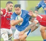  ??  ?? Samoan hooker Ray Niuia on the charge against Tonga. Picture: PHOTOSPORT