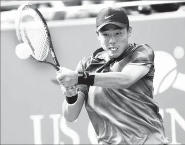  ?? QIN LANG / XINHUA ?? Wu Yibing hits a return to Argentina’s Axel Geller during the junior final of the US Open last September in New York. Wu is looking to a bright future after striking a deal with the US-based Internatio­nal Management Group last month.