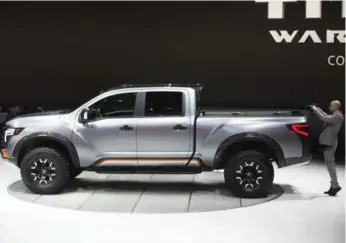  ?? TODD KOROL/TORONTO STAR ?? Canadian Randy Rodriguez, better known for his work on Nissan’s performanc­e cars such as the 370Z, was the lead designer for the new concept Titan Warrior pickup, unveiled at this week’s Detroit auto show.