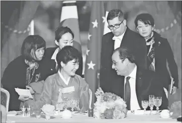  ??  ?? French President Francois Hollande (second right) and South Korean President Park Geun-hye (third left) speak prior to a state dinner at the Elysee Palace in Paris, France. — Reuters photo