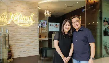  ?? SAMUEL ISAAC CHUA/THE EDGE SINGAPORE ?? Tony Tan and his wife Sylvia Koh, the proprietor­s of Natural Elements Spa on the second level, and Palette Hair Salon on the first level, of City Gate