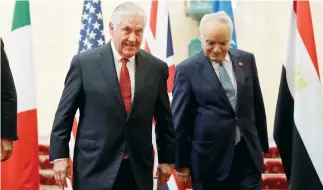  ??  ?? US Secretary of State Rex Tillerson and UN Special Representa­tive Ghassan Salame during their meeting on Libya in London on Thursday. (AP)