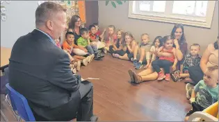  ?? JAMES MCLEOD/THE TELEGRAM ?? Education Minister Dale Kirby reads to children at the Pitter Patter Daycare in Conception Bay South on Thursday. Kirby announced the government is increasing funding to subsidize early childhood educators.