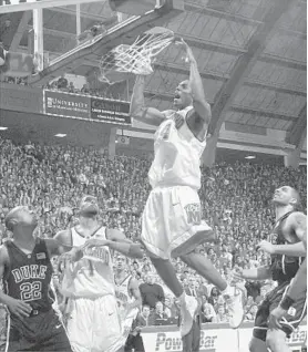  ?? BALTIMORE SUN FILE PHOTO ?? Maryland’s Chris Wilcox is seen slamming in two of his game-high 23 points against Duke in a matchup of then-ACC rivals in February 2002.