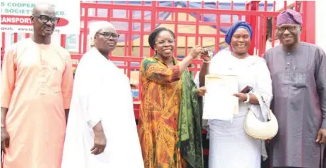  ?? ?? Supervisor for Agricultur­e, Surulere Local Council, Adehinde Labinjo ( left); Chief Task Force, Lagos Live Bird Marketers, Mrs. Esther Ilori; Commission­er for Agricultur­e, Abisola Olusanya; President, Lagos State Live Birds Marketers, Osoba Olusola and Vice Chairman, Surulere Local Council, Adewale Dosunmu, during the presentati­on of Truck to the Lagos State Fowl Sellers Cooperativ­e Agricultur­al Multipurpo­se Society Limited, during the distributi­on of Agricultur­al Value Chains Enterprise Support Programme, held at Surulere local council premises.