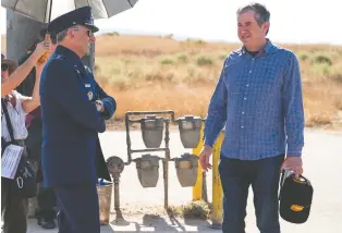  ?? NETFLIX ?? In Space Force, Steve Carell, left, with series creator Greg Daniels (who also helms the series Upload), stars as a general operating above his intellectu­al pay grade.