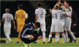  ??  ?? Scotland captain Andrew Robertson looks dejected after defeat in the qualifier against Russia. Photograph: Lee Smith/Action Images via Reuters