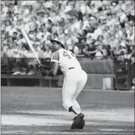  ?? Associated Press ?? The Atlanta Braves’ Hank Aaron watches the flight of the ball as he hits his 700th career home run in a game with the Philadelph­ia Phillies in Atlanta in 1973.