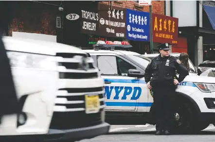  ?? BING Guan/reuters ?? On advice of higher-ups, a Virginia teacher dropped a lesson built around a data set on use of force in the New York Police Department.