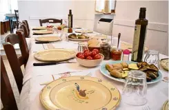  ??  ?? A table set with appetisers for lunch at the Arrosteria Borgo Antico, a restaurant in the historic centre of Ceglie Messapica, a town known for its good food.