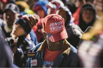  ?? AUDRA MELTON/THE NEW YORK TIMES 2022 ?? A supporter attends a March 26 rally hosted by Donald Trump in Commerce, Ga.