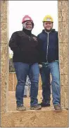  ?? SUBMITTED PHOTO ?? Bethany and Michael Robinson show the front door to their future home. After putting the walls up on May 9, the family moved in on July 4.