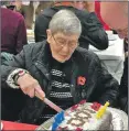  ??  ?? Cathy Potter cuts the cake.