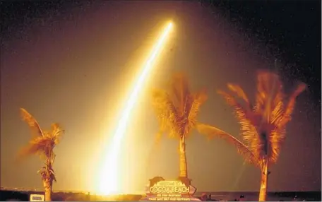  ?? Malcolm Denemark Associated Press ?? IN A TIMED exposure, spectators watch as the Kepler satellite launches from Cape Canaveral on March 6, 2009. The spacecraft’s condition has been upgraded, and it will be checked through the week to ensure that it’s ready to return to science mode.