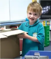  ??  ?? Jackson Fowler unpacks books at Lardner District Primary School last week for his long awaited first day of school.
