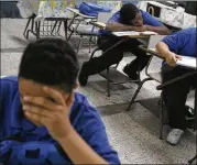  ?? ASSOCIATED PRESS 2008 ?? Students sit at their desks in a classroom at a middle school in San Juan, Puerto Rico, in 2008. Puerto Rico currently has a total of 1,292 public schools that serve 365,000 students.
