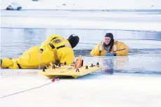  ?? BEN GARVER/AP ?? The Pittsfield (Massachuse­tts) Fire Department conducts ice rescue drills. A New Jersey man has died after falling through the ice.