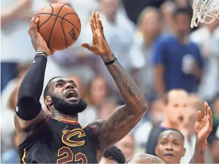  ??  ?? Cavaliers forward LeBron James shoots against Celtics guard Jabari Bird during Game 6 of the Eastern Conference finals Friday in Cleveland. James 46 points 11 rebounds and nine assists in the Cavs’ 109-99 victory KEN BLAZE/USA TODAY SPORTS